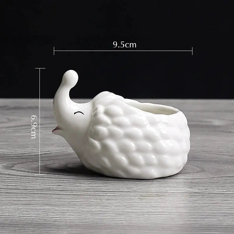 a small white ceramic bird on a table