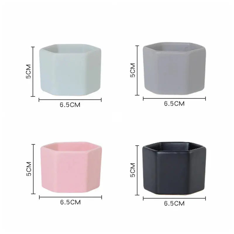 four different colors of vases on a white background