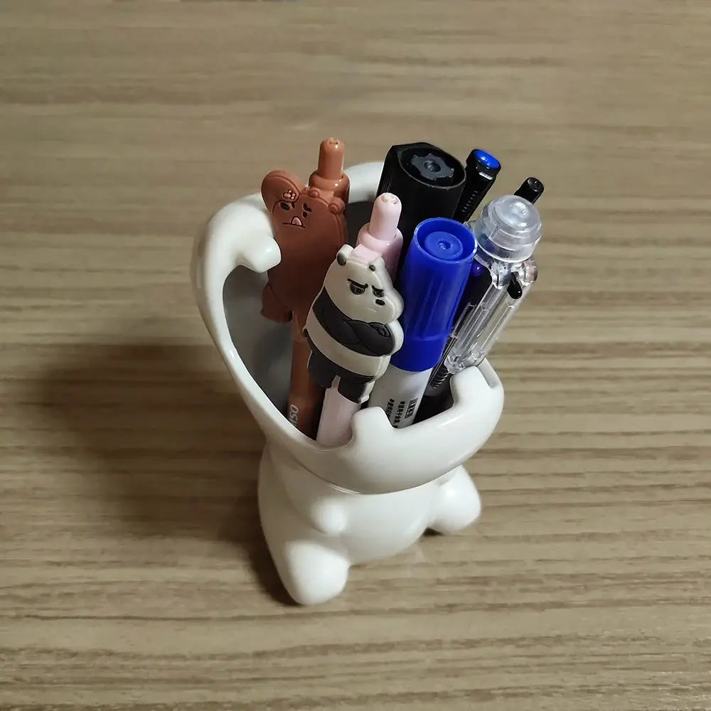 a white cup filled with different items on top of a wooden table