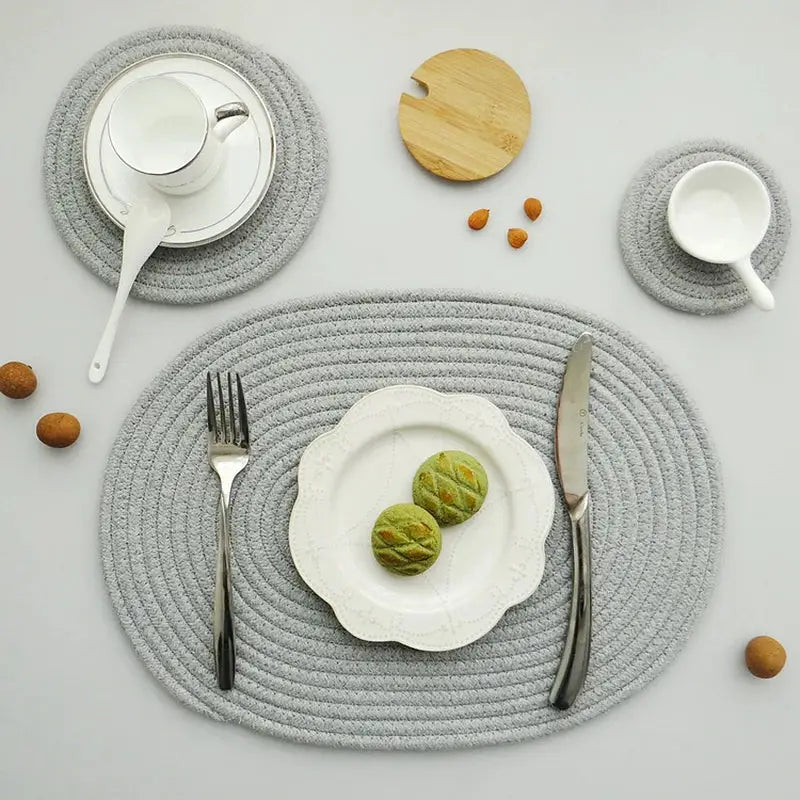 a place setting with a plate, silverware, and a bowl