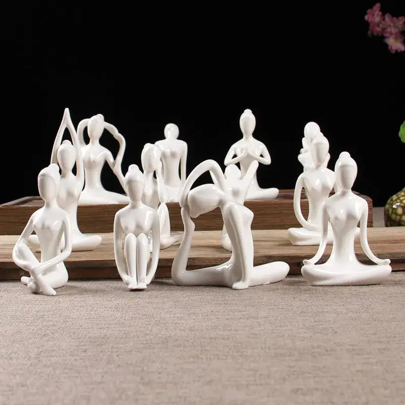 a group of white figurines sitting on top of a table