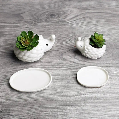 a couple of white plates sitting on top of a wooden table
