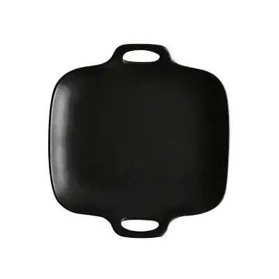 a black cutting board on a white background