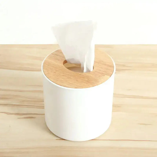 a tissue dispenser on a wooden surface