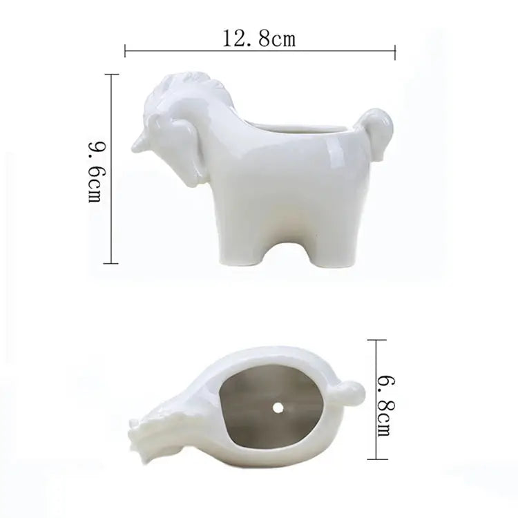 a white horse shaped vase with a hole in the middle