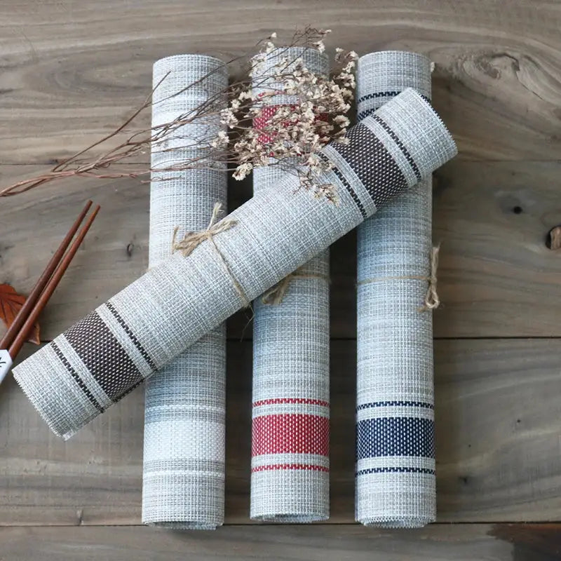 a group of rolled up papers sitting on top of a wooden table