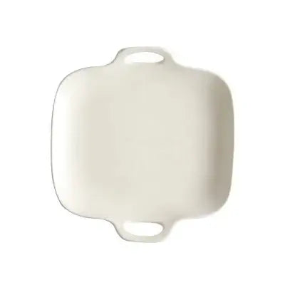 a white serving tray with handles on a white background