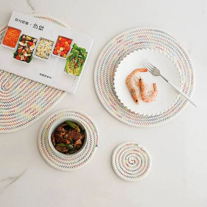 a white table topped with plates and bowls of food