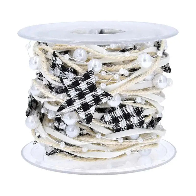 a spool of white and black checkered ribbon on a spool of white