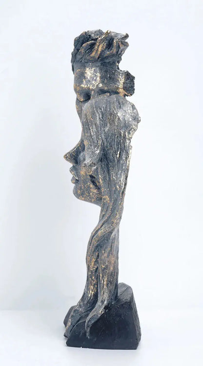 a sculpture of a woman's head on a black base