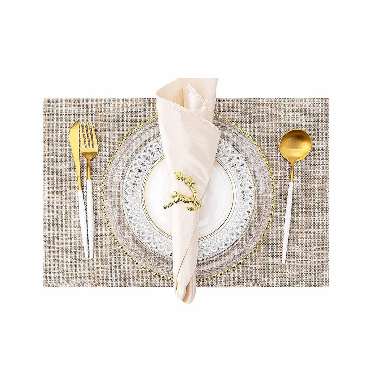 a place setting with silverware and a napkin