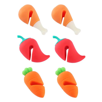 a set of four plastic carrots and a pepper