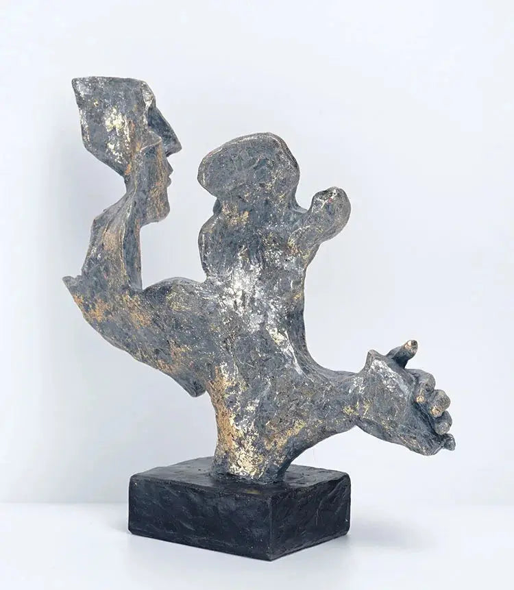 a sculpture of a person holding a bird