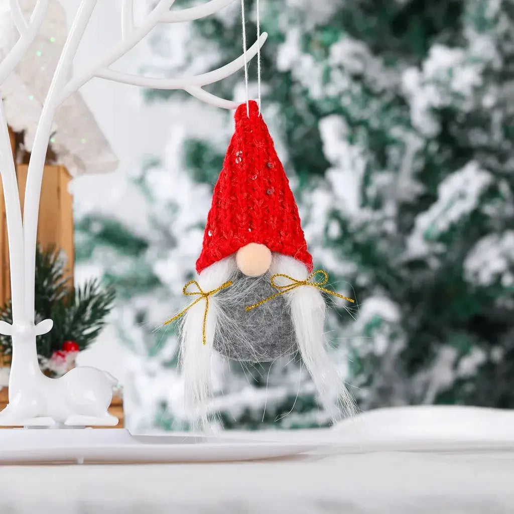 a gnome ornament hanging from a tree