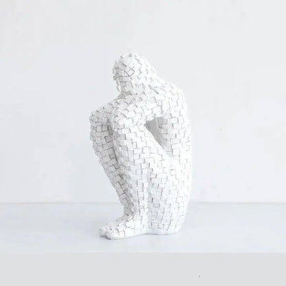 a white sculpture sitting on top of a table