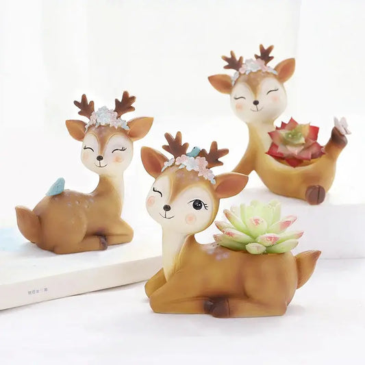 a group of deer figurines sitting on top of a table