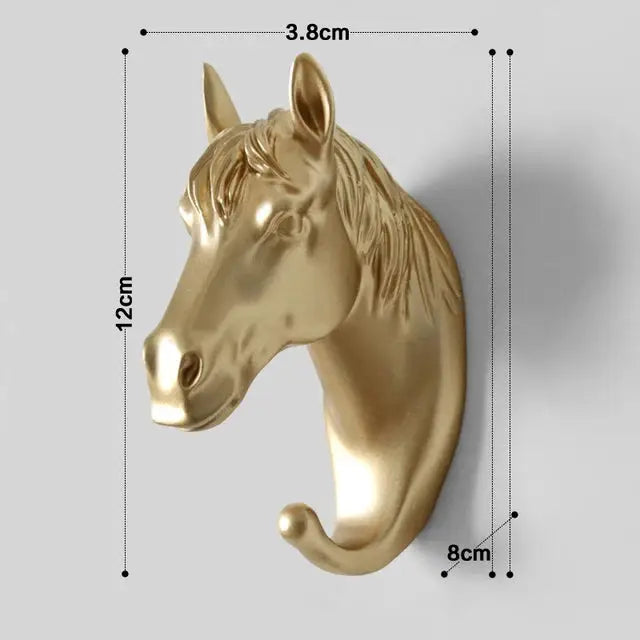 a golden horse head mounted on a wall