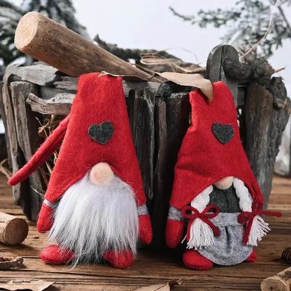 a pair of red gnome slippers sitting on top of a wooden table