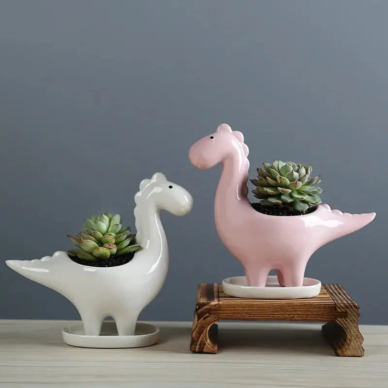a couple of ceramic animals sitting next to each other