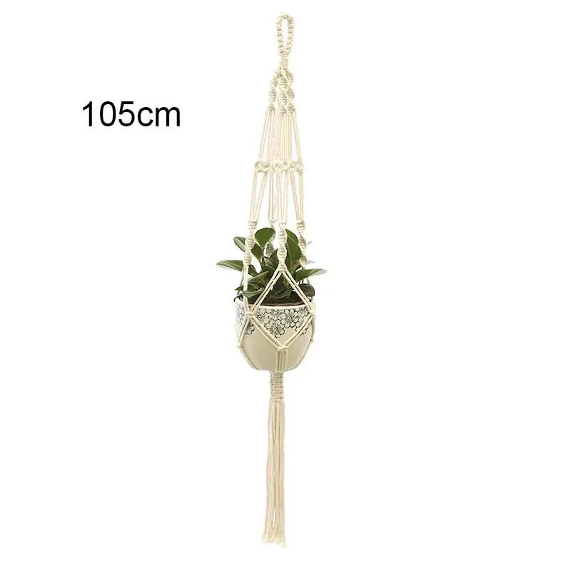 a white hanging planter with a plant in it