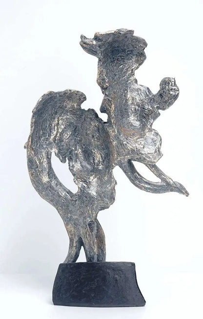a metal sculpture of a man riding a horse