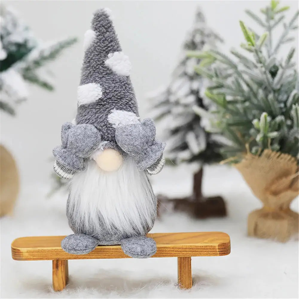 a gnome figurine sitting on top of a wooden bench