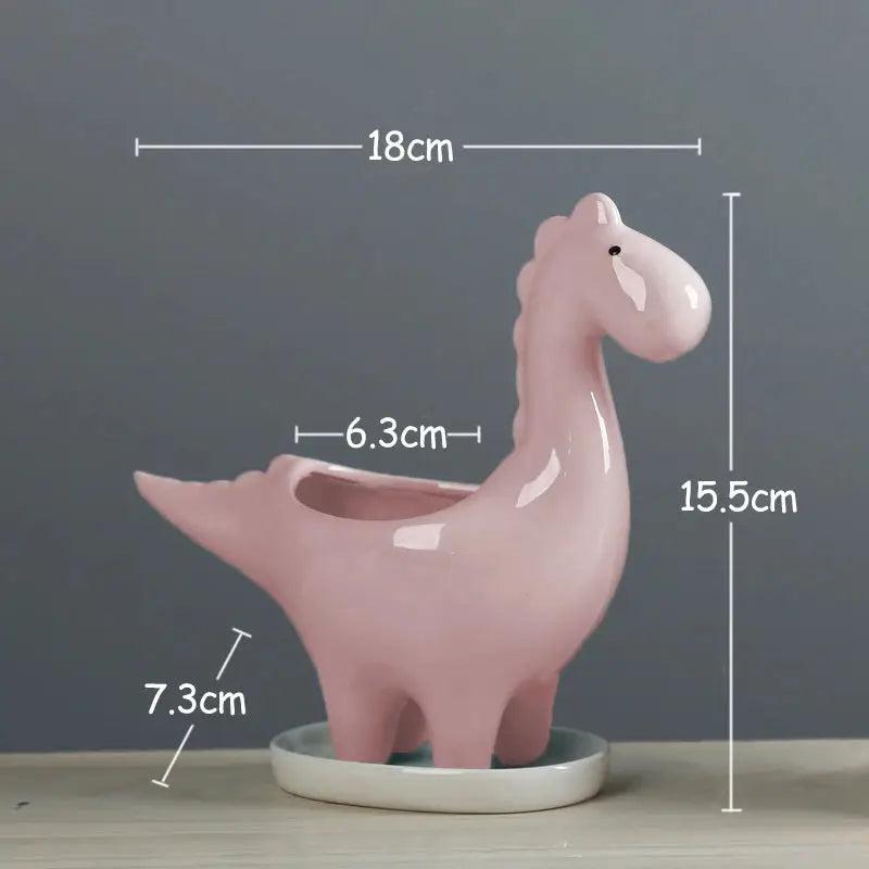 a pink ceramic animal sitting on top of a table