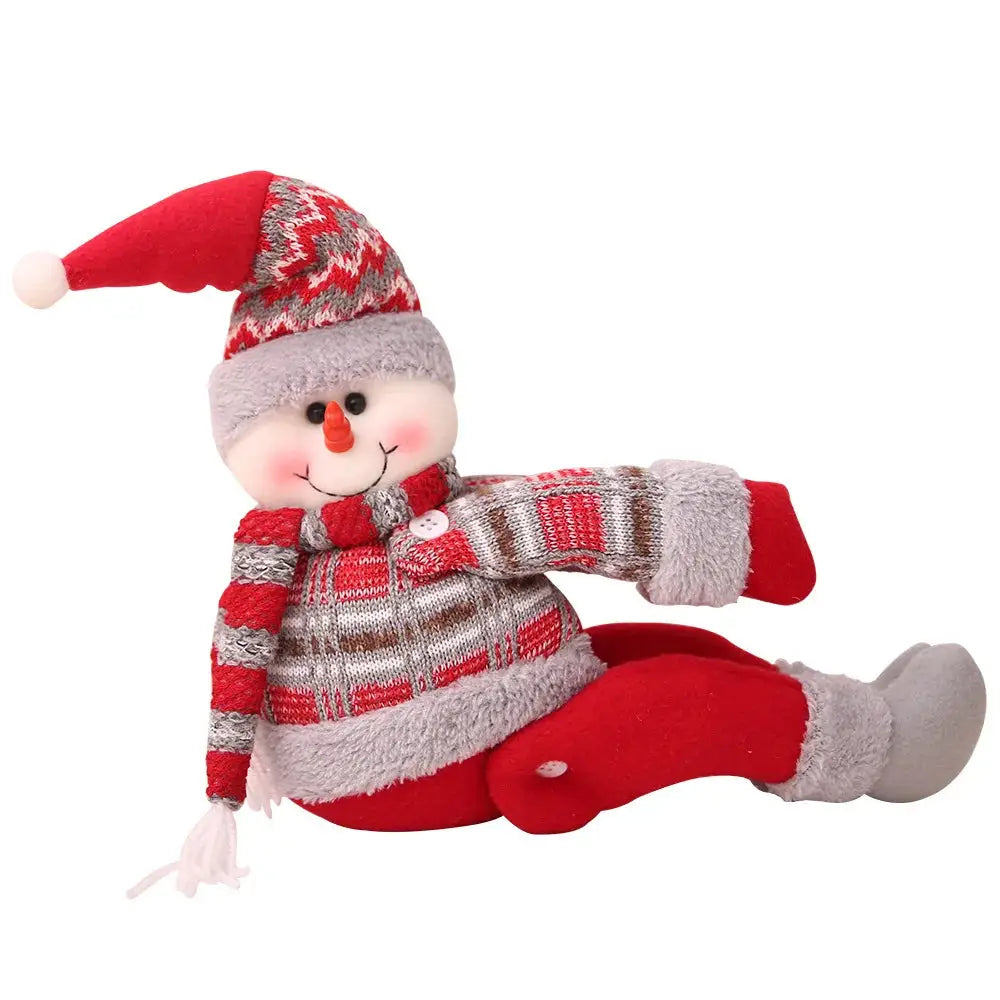 a stuffed snowman wearing a red hat and scarf
