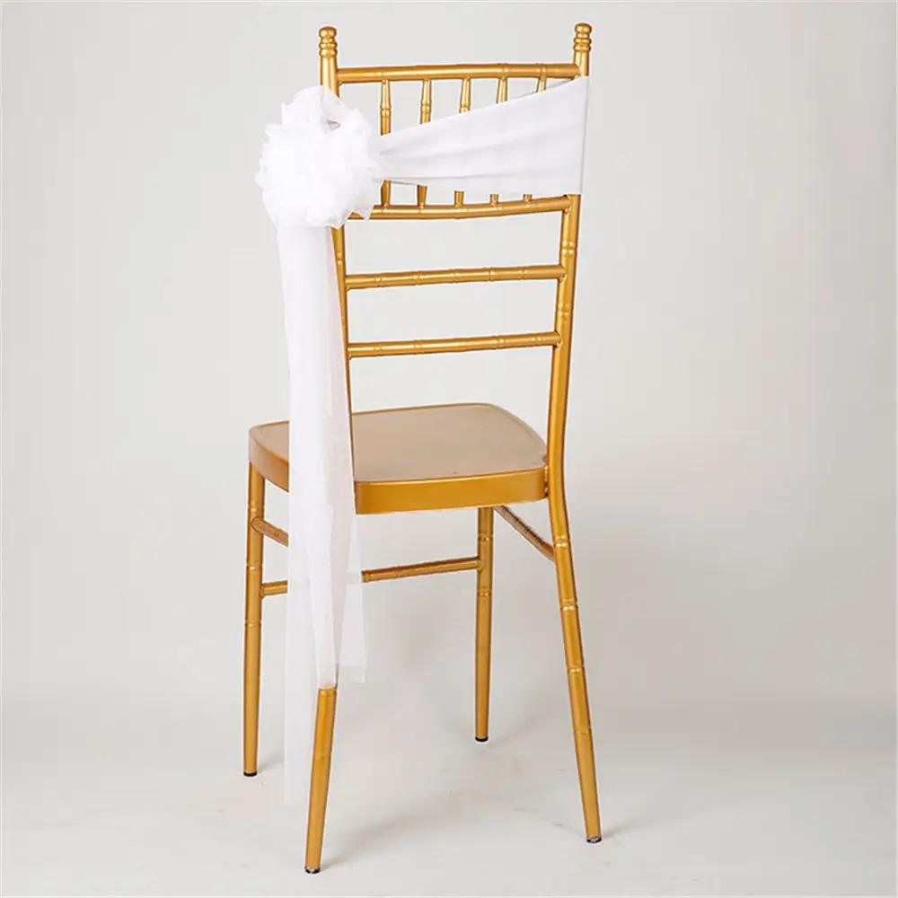 a gold chair with a white sash on it
