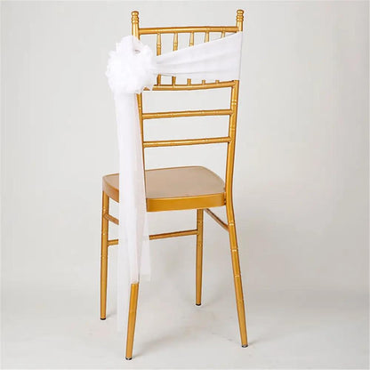 a gold chair with a white sash on it