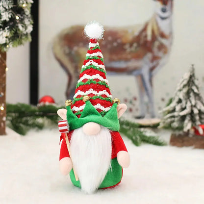 a small christmas gnome with a green and red hat