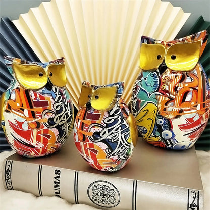 a couple of ceramic animals sitting on top of a book