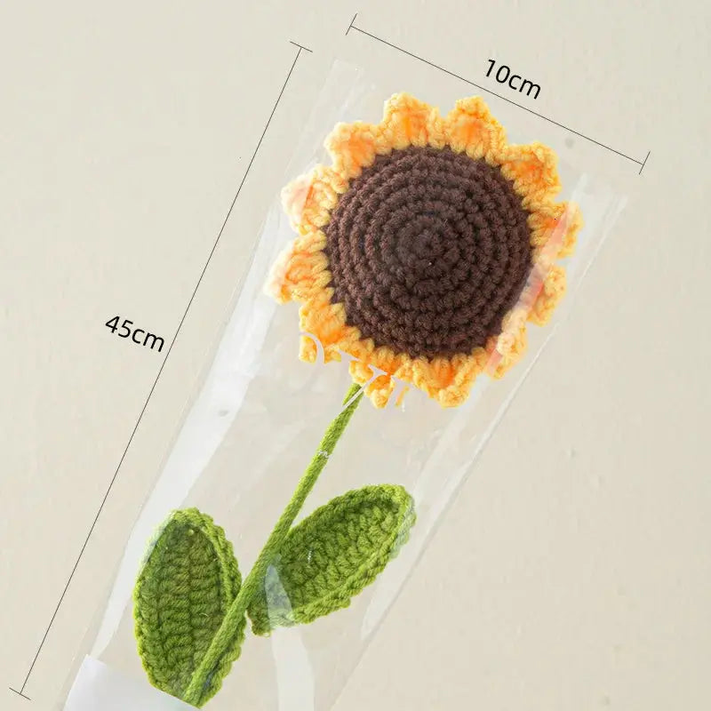 a crocheted sunflower sitting on top of a table