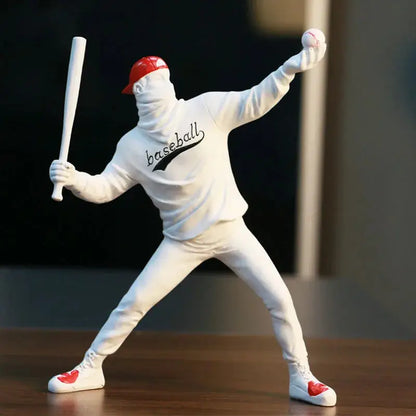 a figurine of a baseball player holding a bat