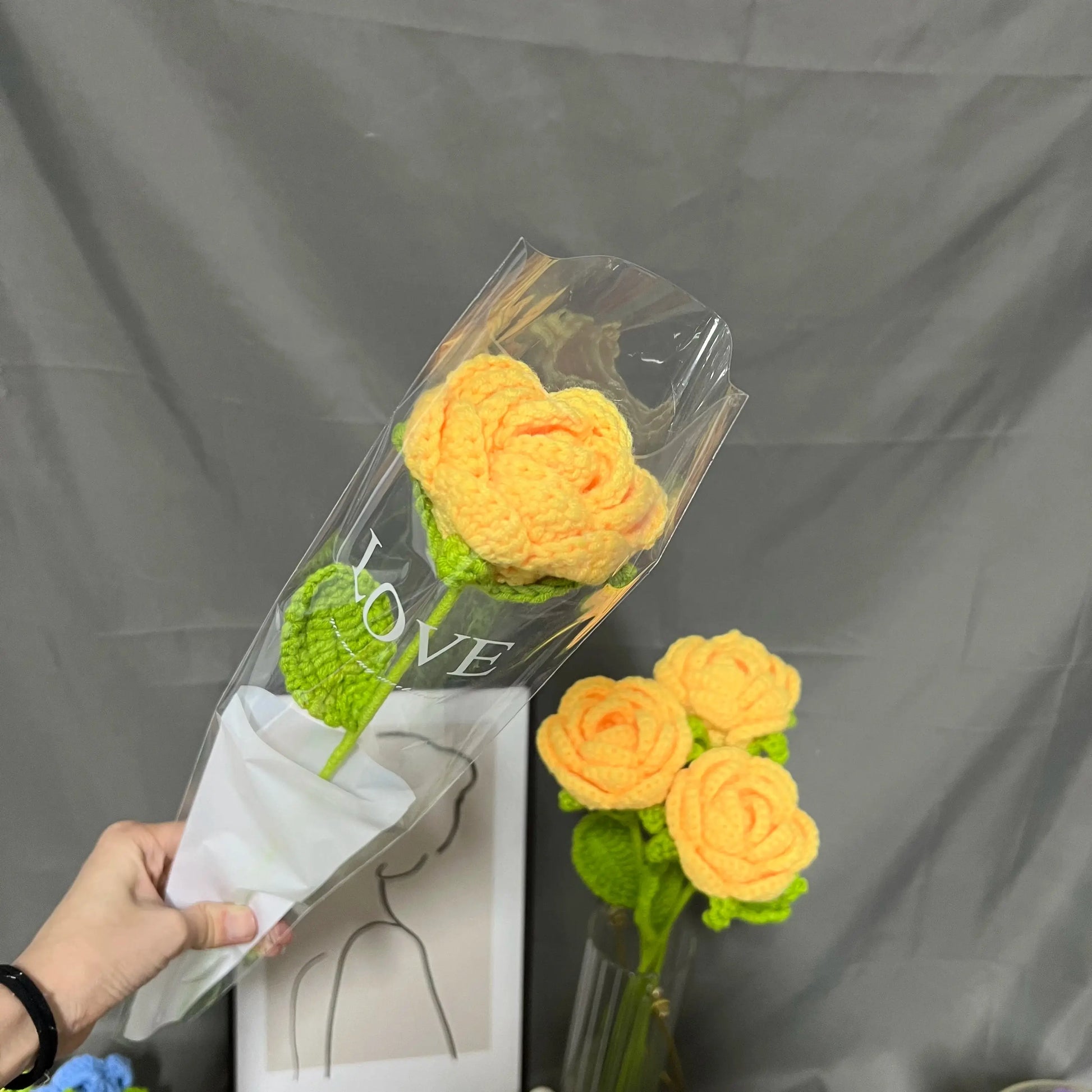 a person is holding a bouquet of flowers