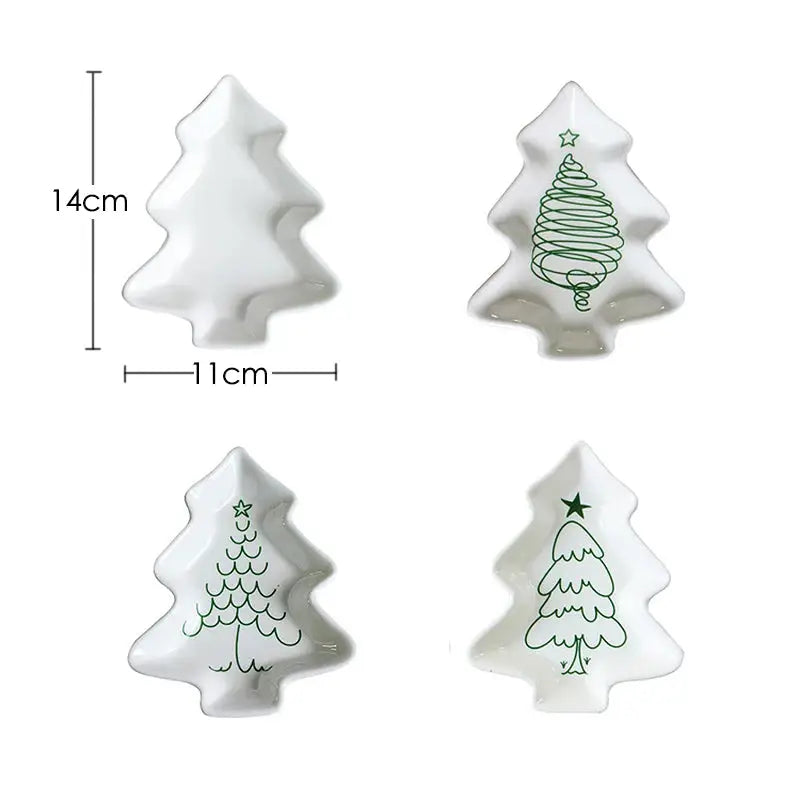 a set of three ceramic christmas trees on a white background