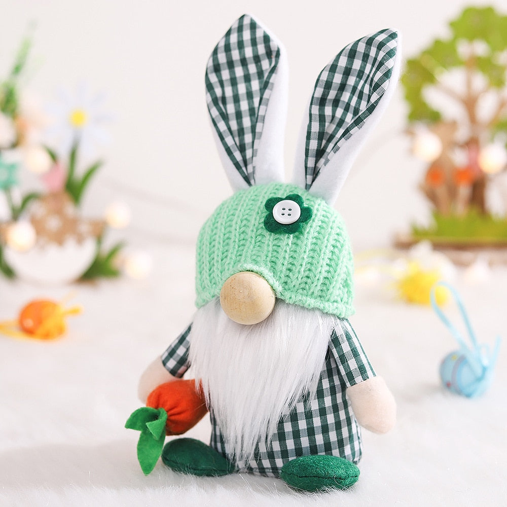a stuffed rabbit with a green hat and a carrot