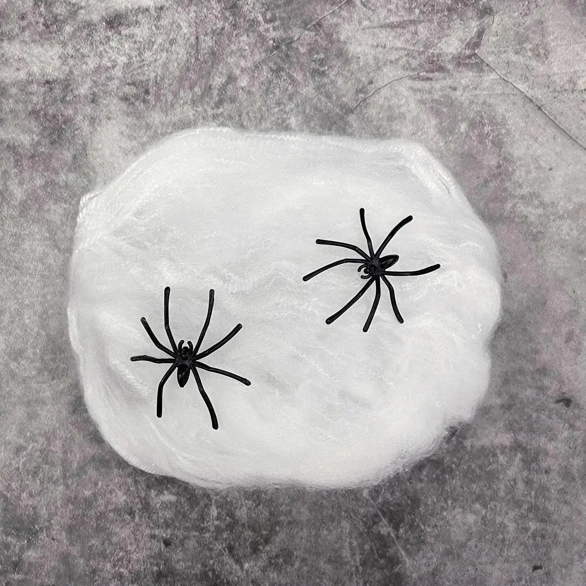 a rock with two black spider's on it