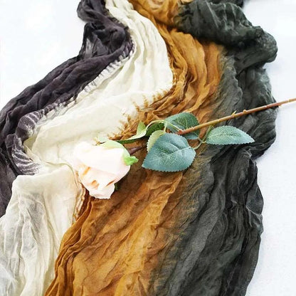 a rose that is sitting on a piece of cloth
