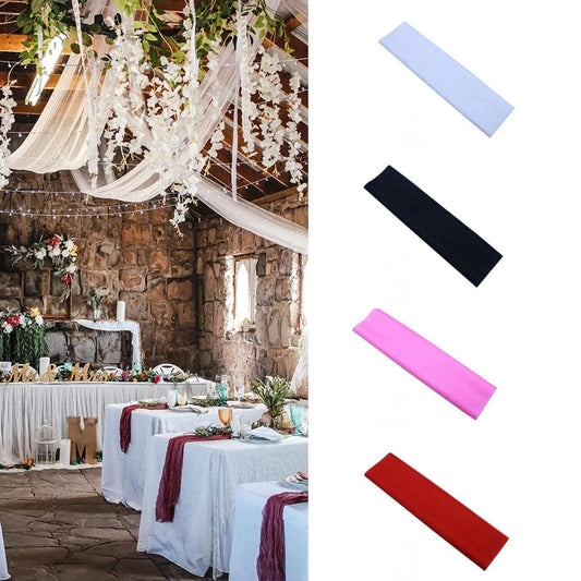 a table with white table cloths and red and white table cloths