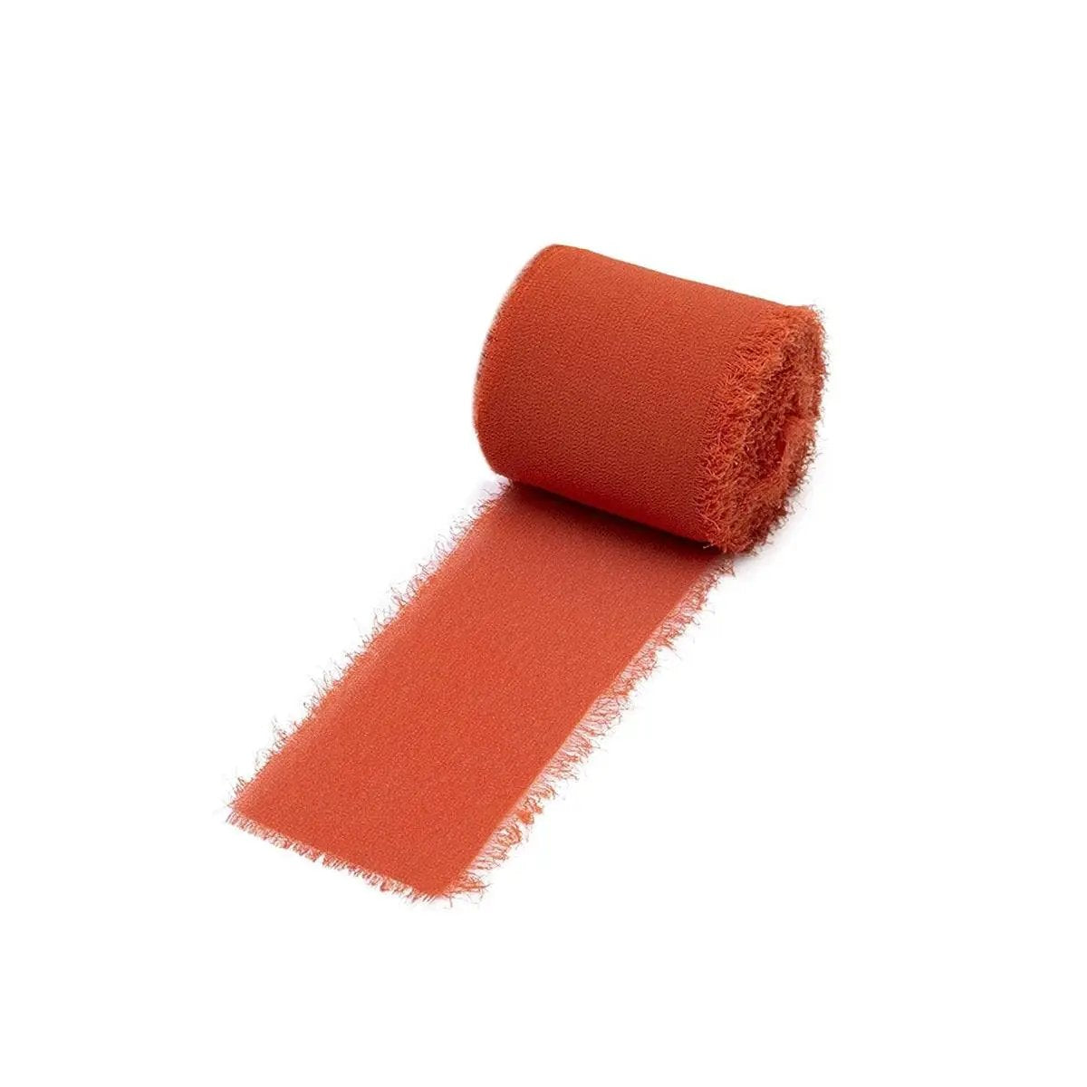 a roll of orange fabric on a white background