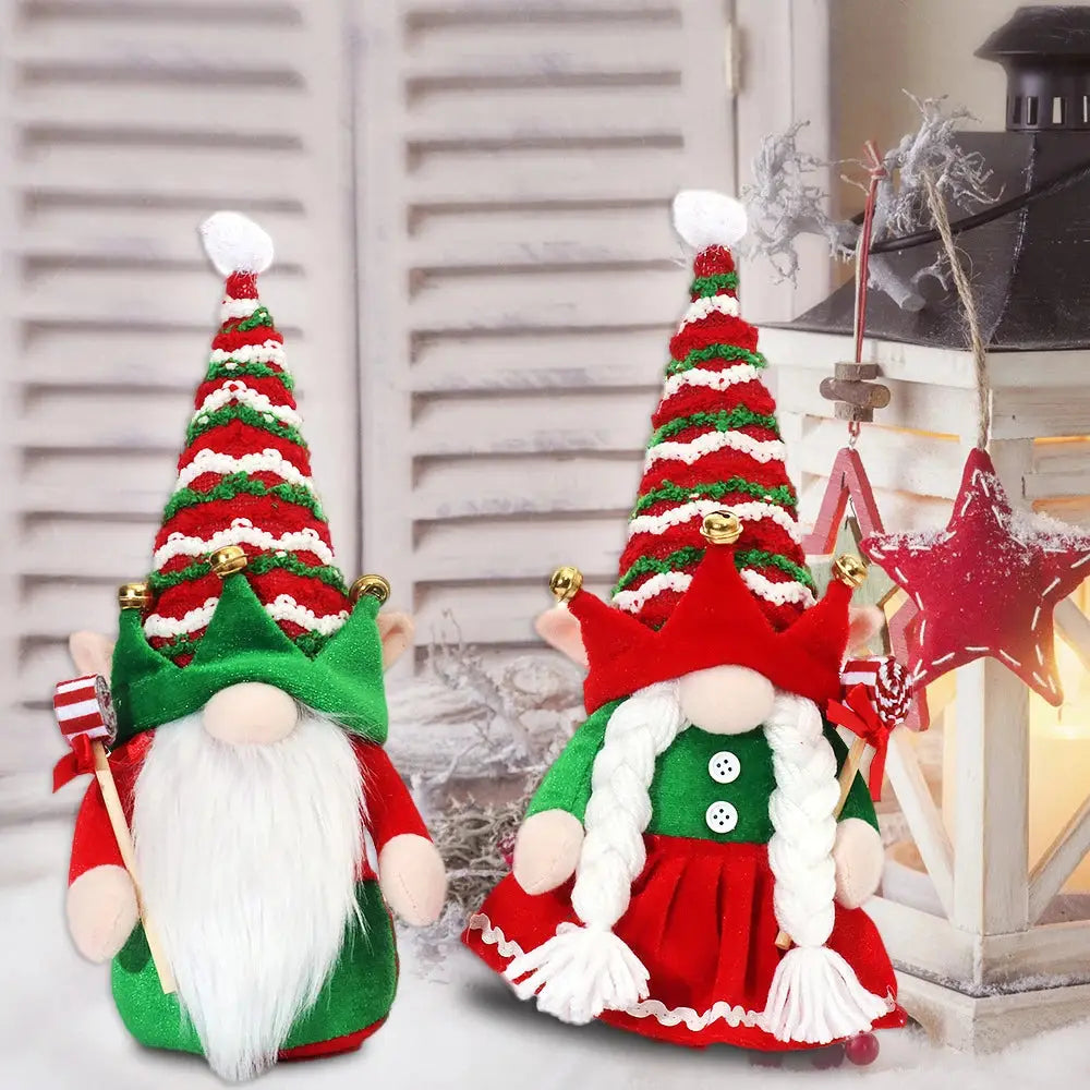 a couple of christmas gnomes sitting next to each other