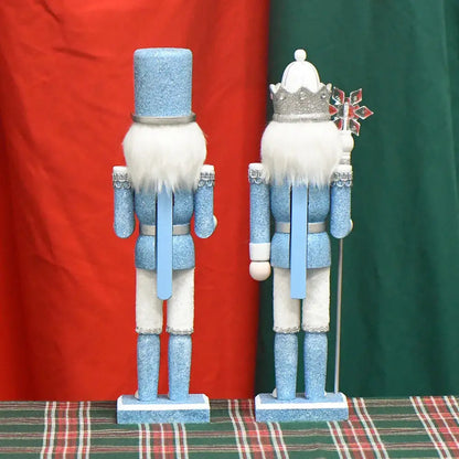 a blue and white nutcracker standing next to a red and green flag