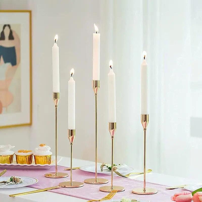 a white table topped with lots of candles