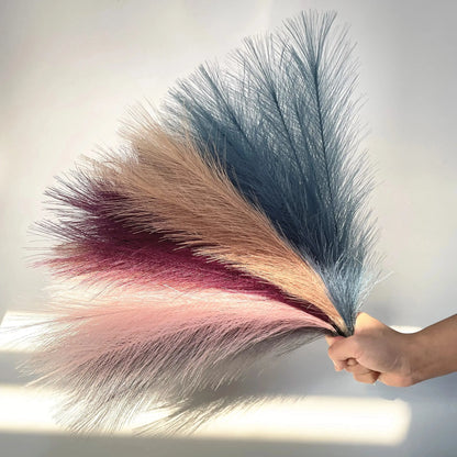 a person is holding a fake hair piece