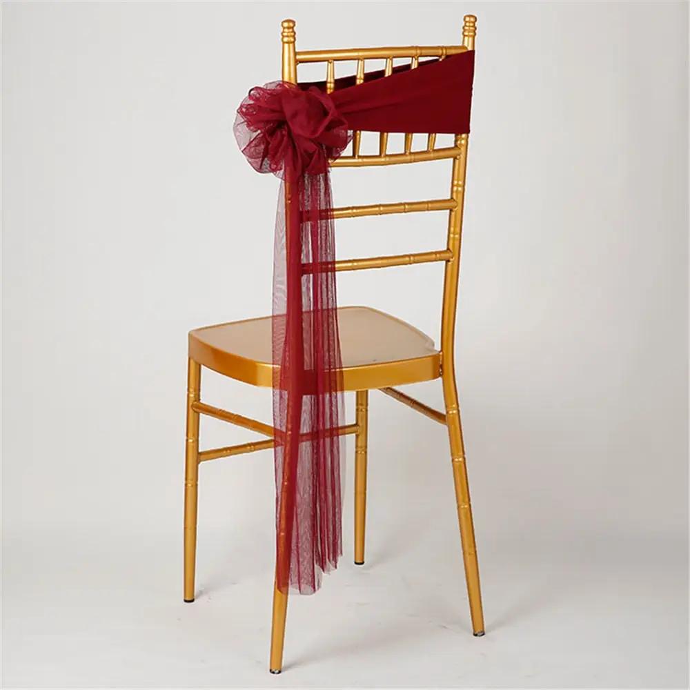 a chair with a red sash on top of it