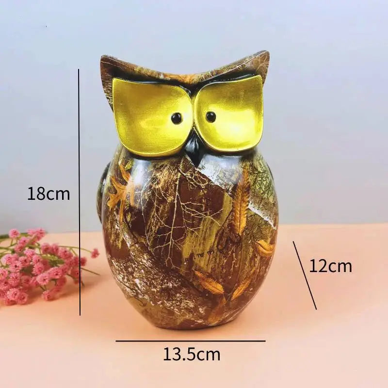 a glass owl sitting on top of a table