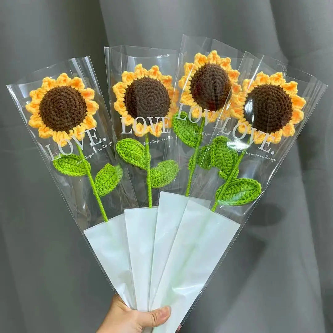 a person holding a bunch of fake sunflowers