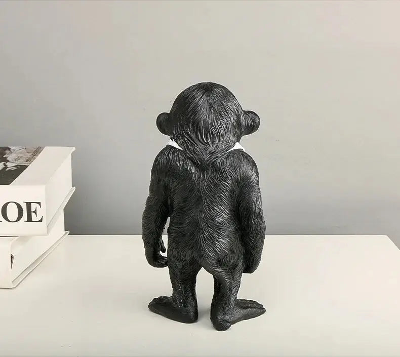 a black bear figurine sitting on top of a table