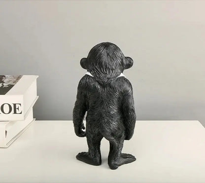 a black bear figurine sitting on top of a table
